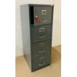 A vintage gun metal grey three drawer filling cabinet with lockable cabinet above