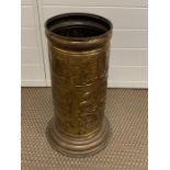 A brass umbrella stand