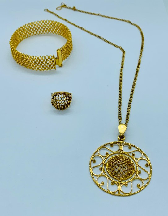 A 22ct Asian Gold Wedding set comprising a ring, pendant on chain and a bangle in a honeycomb design