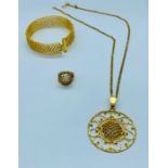 A 22ct Asian Gold Wedding set comprising a ring, pendant on chain and a bangle in a honeycomb design