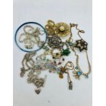 A small volume of vintage and silver costume jewellery.
