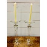 A pair of glass candlesticks