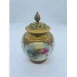 A Royal Worcester lidded vase with repairs to finial and lid.