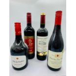 A selection of four mixed red wine