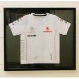 A Framed Mercedes McLaren shirt, child's size.