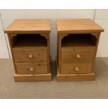A pair of pine bedsides cabinets with two drawers under