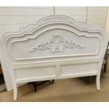 A white carved headboard