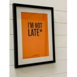 A framed poster "I'm Not Late"