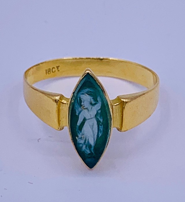 An 18ct yellow gold ring with small cameo.