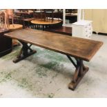 A large oak wake/dining table with eight gothic style oak dining chairs to include one carver (H76cm