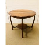 An oak two tiered scalloped edge occasional table