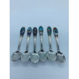 Six Scandinavian souvenir spoons depicting Nordic scenes