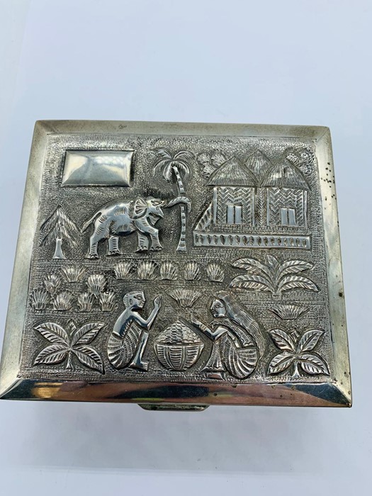 An Indian Silver embossed cigarette box