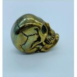 A brass cased vesta case in the form of a skull