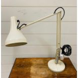 A cream Anglepoise lamp