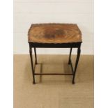 A scalloped edged rectangular side table