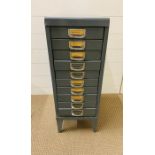 A small vintage gun metal grey multi drawer cabinet