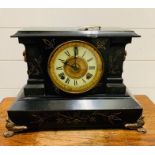 Ansonia iron mantel clock with brass claw feet and dragon brass handles to side