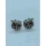 A pair of silver Owl shaped cufflinks
