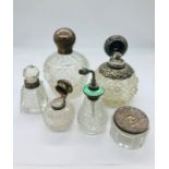 A Selection of silver topped scent bottles