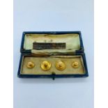 A Boxed set of 18ct gold shirt studs total weight 4.4g