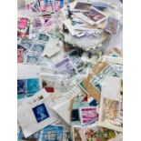 A large selection of worldwide stamps to include Great Britain, US, Canada, Hong Kong, Singapore,