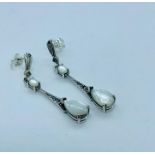 A pair of silver and Moonstone Art Deco style earrings