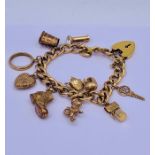 A rolled gold bracelet with ten hallmarked 9ct gold charms.