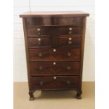 Mahogany chest of drawers with three large drawers, two smaller drawers and a small double drawers