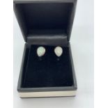 A pair of silver pear shaped Opal stud earrings cased