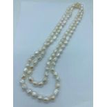 An opera length freshwater blister Pearl necklace