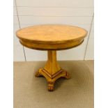 A Lock Stock and Barrel Hampton walnut pedestal table with lion claw feet