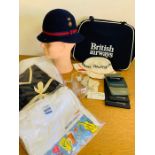 A collection of British Airways memorabilia to include uniform hat, wallets card and t-shirt