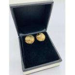 A pair of yellow gold earrings in the form of knots