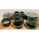A selection of Poole Studio green reactive glaze port tea set to include six cups and saucers and