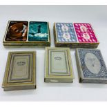 A selection of linen finish playing cards and two sealed picture cards