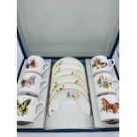 A Royal Worcester boxed 'Butterflies' pattern set of six coffee cans and saucers.