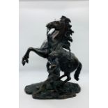 A Pair of Bronze Marley Horses, plinth of one is marked Coustou