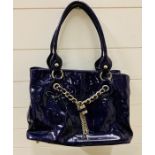 Russell and Bromley purple handbag with padlock details to front
