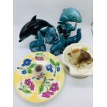 A selection of Poole pottery to include animals birds and plates.
