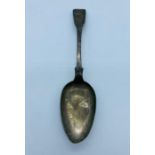 A single silver Georgian serving spoon.