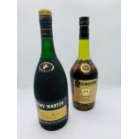 A Bottle of Remy Martin and a Bottle of Martell Cognac.