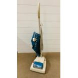 A Hoover upright vacuum