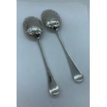 A Pair of decorated silver spoons, hallmarked 1893-94 Sheffield, makers mark HA
