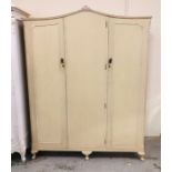 A three door painted wardrobe