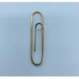 A gold money clip in the form of a paperclip (5.96g)
