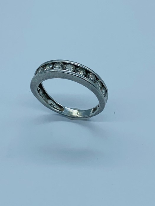 A Platinum and diamond half eternity ring.