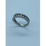 A Platinum and diamond half eternity ring.