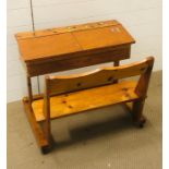 A children's pine double school desk with bench