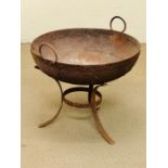 A large fire pit with handles on splayed tripod stand (Diam 70cm)